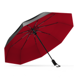 The Black and Red Best-Selling Windproof Compact Travel Umbrella is pictured on it's own, open and leaning to the left.