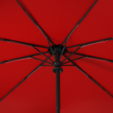 Close-up of Repel's windproof compact umbrella frame, with bold red interior and black exterior.