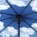 Close-up of Repel's windproof compact umbrella frame, featuring a blue sky motif interior.