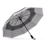 Grey Top windproof compact umbrella, open and leaning left.