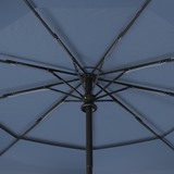 Close-up of reinforced fiberglass frame and ribs of Repel's navy blue windproof compact umbrella.