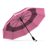 The Pink Top Best-Selling Windproof Compact Travel Umbrella is pictured on it's own, open and leaning to the left.