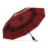 Red Top windproof compact umbrella, open and leaning left.