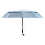 An image of the profile view of a slate blue colored, open travel Repel umbrella.